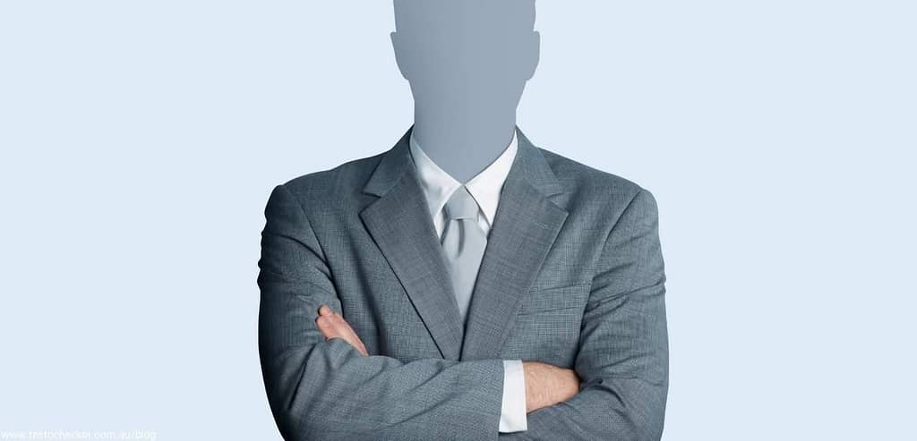 Man in suit with face obscured for anonymity purposes. 