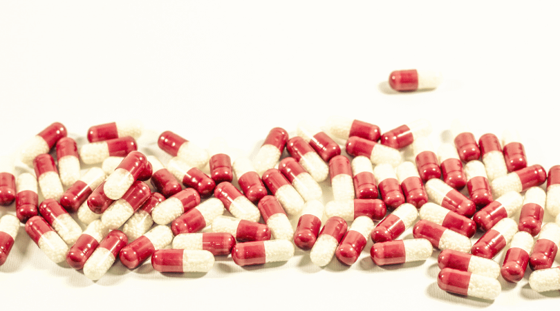 melatonin capsules scattered on a table